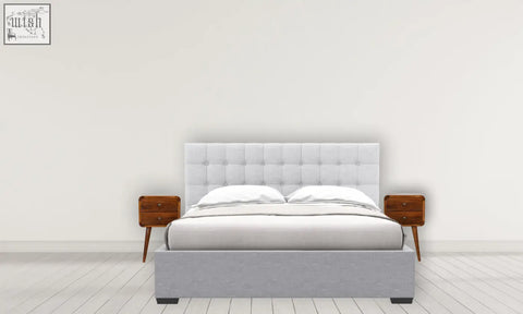 Gray upholstered bed with tufted headboard and matching platform base next to a solid mango wood curved bedside table