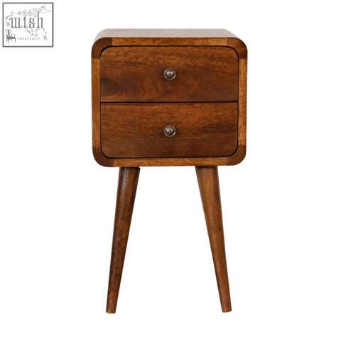 A mid-century modern mini chestnut curved bedside table made of solid mango wood with two drawers and tapered legs