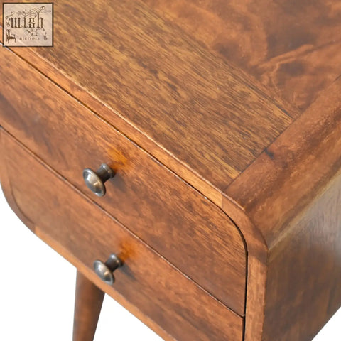 Mini chestnut curved bedside table in warm brown solid mango wood with curved drawers and silver-toned knobs
