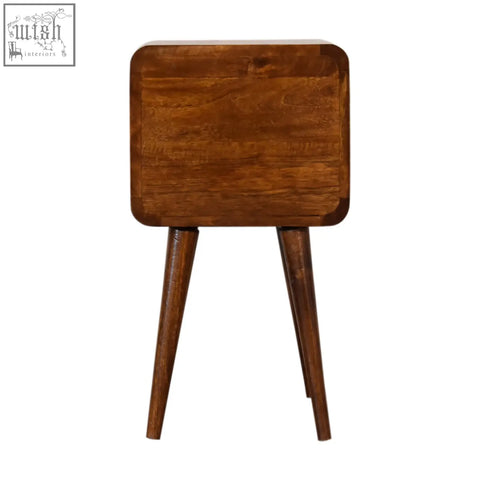 Mini chestnut curved bedside table made of warm medium-brown solid mango wood with tapered legs and square top