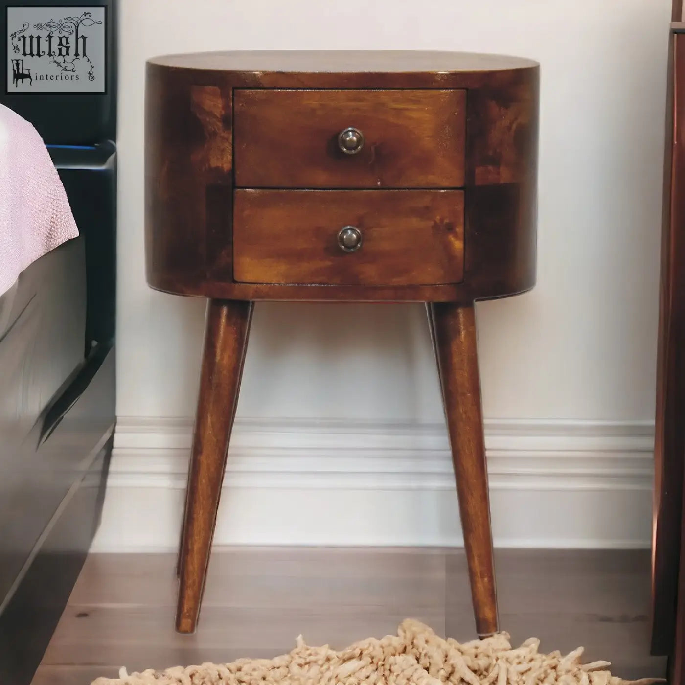 Dark brown wooden mini chestnut rounded bedside table with two drawers and tapered legs for bedroom use
