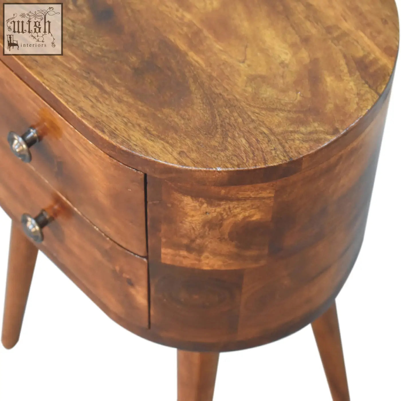 Warm-toned wooden mini chestnut rounded bedside table with two drawers and tapered legs for bedroom use