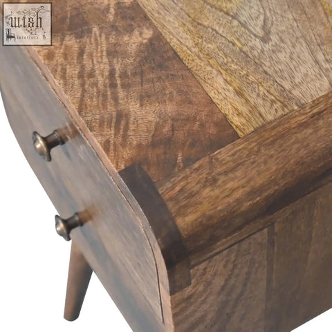 Mini curved grey washed bedside table with solid mango wood frame and patchwork brown top featuring curved drawers