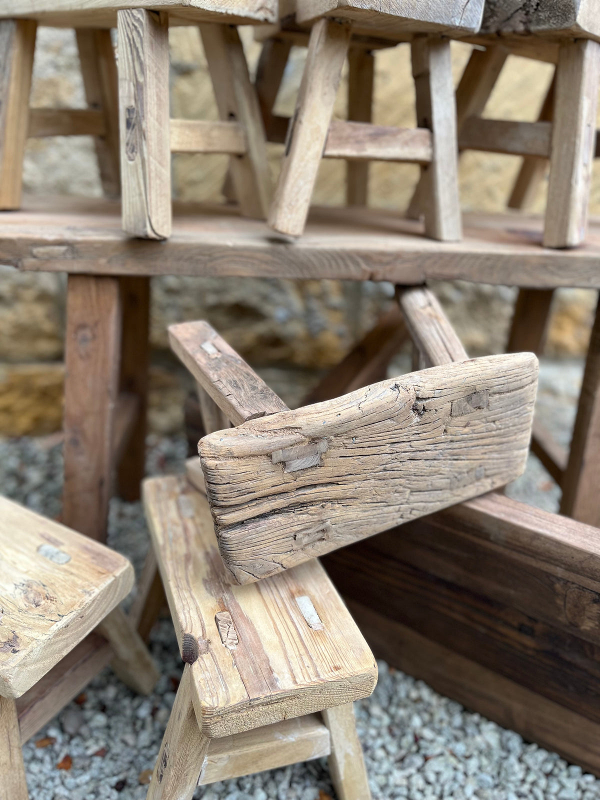 Weathered light brown mini elm stool with rustic handcrafted design and visible wood grain patterns