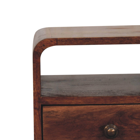 Dark wood mini honey caramel curved bedside table with open slot and brass knob drawer for bedroom use