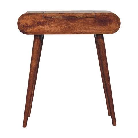 A sleek mini honey caramel wooden dressing table with a foldable mirror and tapered legs in rich brown finish