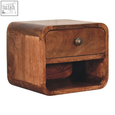 A honey caramel mini wooden nightstand with open slot and single drawer made of mango wood with a warm finish