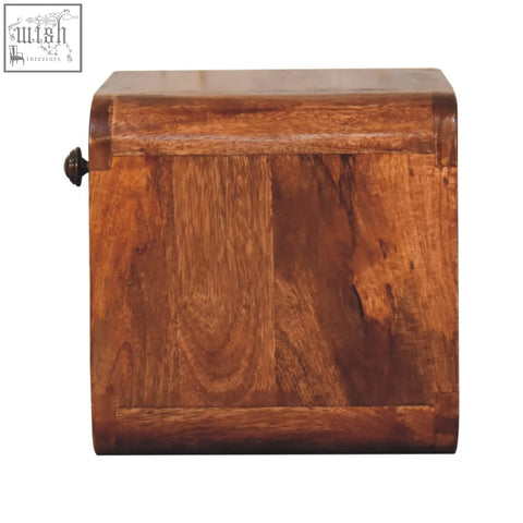 A rustic honey caramel mango wood mini bedside box with open slot and dark metal latch for wall mounting