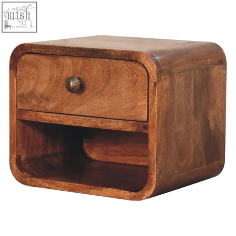 Warm-toned honey caramel mango wood nightstand with single drawer rounded edges and open slot bedside design