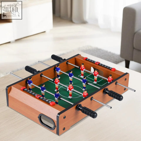 Wooden mini indoor foosball table with red and blue players green field scoring sliders and two soccer balls
