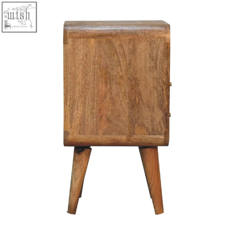 Rustic mini lille curved bedside table in warm medium brown solid mango wood with visible grain and open shelf