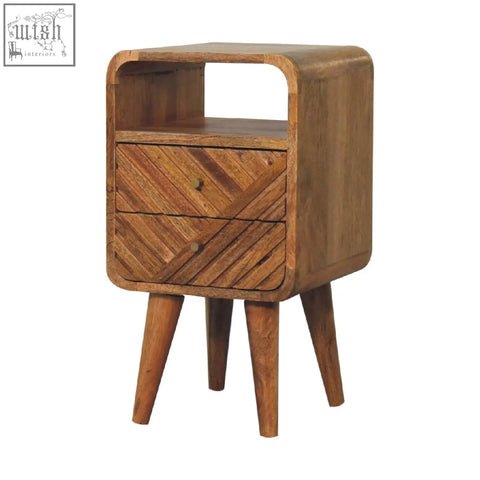 A mid-century modern mango wood nightstand with warm brown finish two drawers and an open shelf on tapered legs