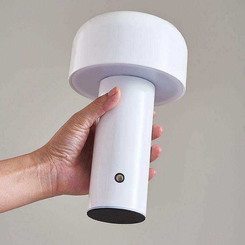 White mini mushroom lamp with rounded dome top and black base perfect for desk lighting and decor