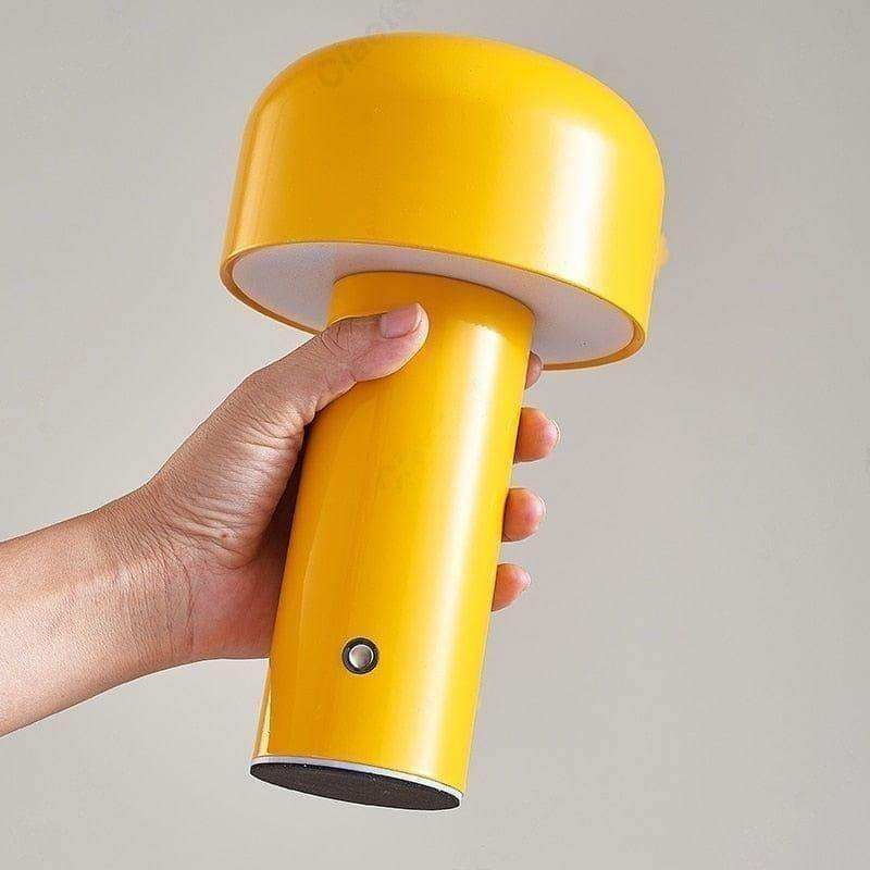 Bright yellow mini mushroom lamp with smooth glossy finish and cylindrical base perfect for desk use