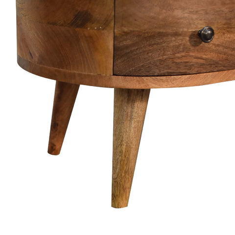 Mini oak-ish wave coffee table with warm wood, curved top, tapered legs, and dark metal drawer knob perfect as a coffee table