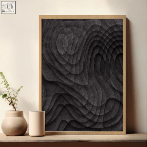 A framed set of 3 minimalist art prints featuring dark charcoal abstract topographic wave textures in wood frames