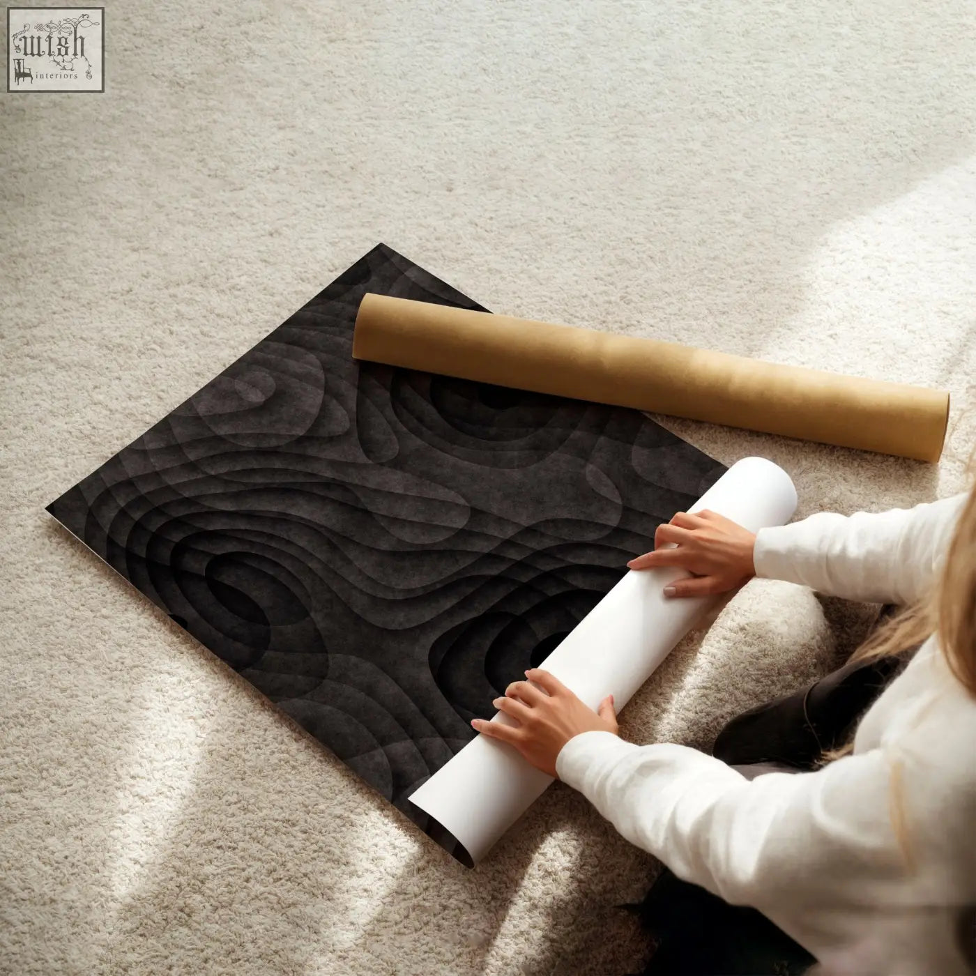 Black textured minimalist art prints with dark charcoal concentric wave patterns displayed on carpeted floor