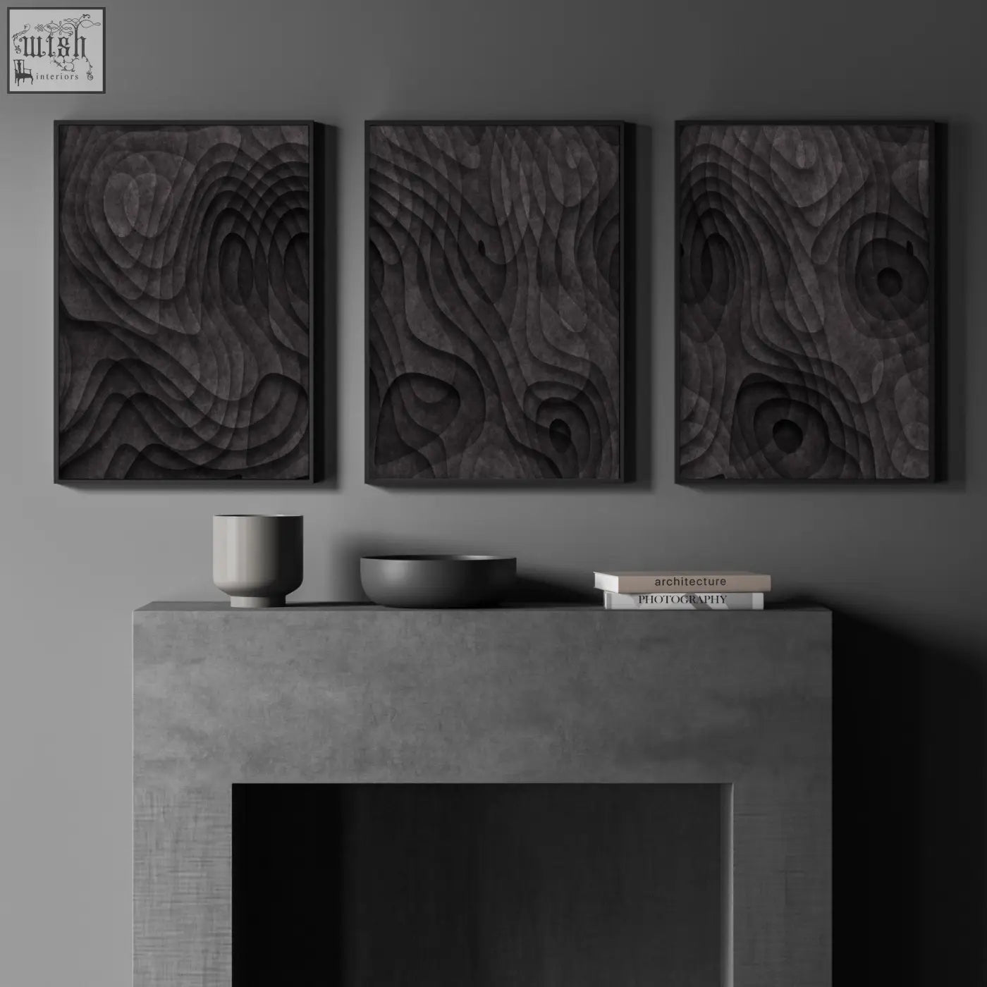Three dark charcoal minimalist art prints with textured swirling patterns hang above a concrete fireplace mantel