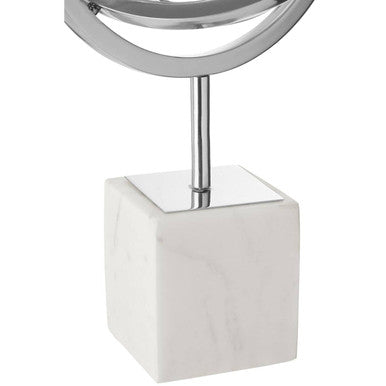 A sleek vanity mirror with a bright silver frame and separate white marble base from mirano silver sculpture line