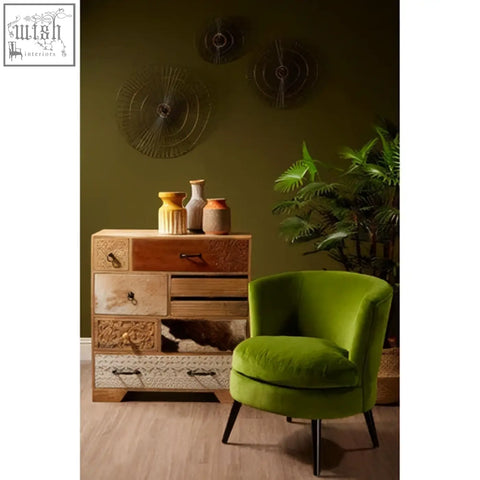 Vibrant green velvet armchair with sleek black metal legs next to mirano small abstract wall art piece