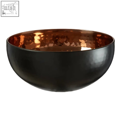 Miressa medium hammered serving bowl in black hammered metal with a copper interior perfect for serving food
