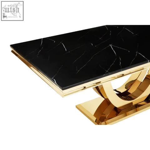 Moda black faux marble dining table with a black marble top and gold-toned metal legs and base