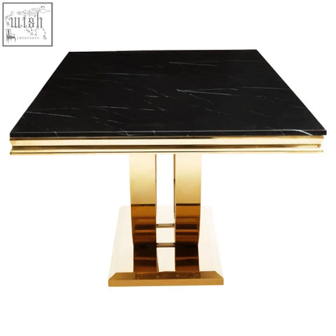 Moda black faux marble dining table with sleek gold pedestal base and rectangular faux marble top