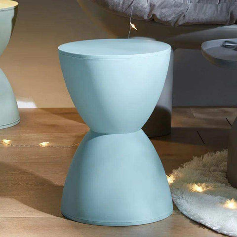 A sleek light blue ceramic side table with a modern hourglass design from moda hourglass stools collection