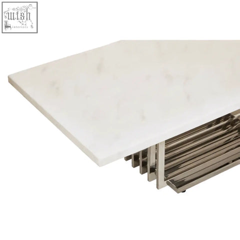 Moda white faux marble coffee table with smooth white top and silver finish frame featuring vertical slats base