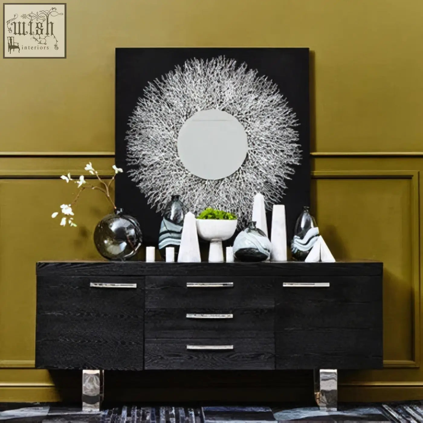 Black wood sideboard with silver metal handles and legs complements abstract mirrored wall art for modern decor