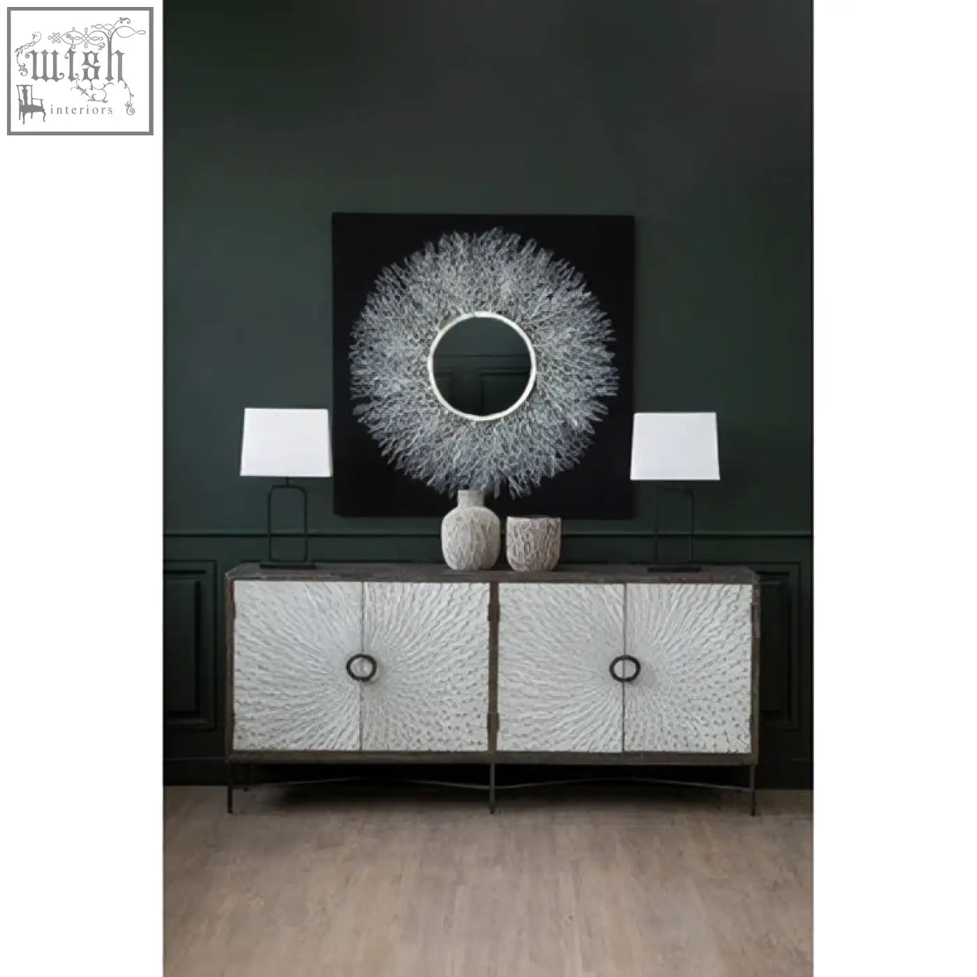 Silver textured sideboard with black metal frame and circular handles paired with modello abstract mirrored wall art