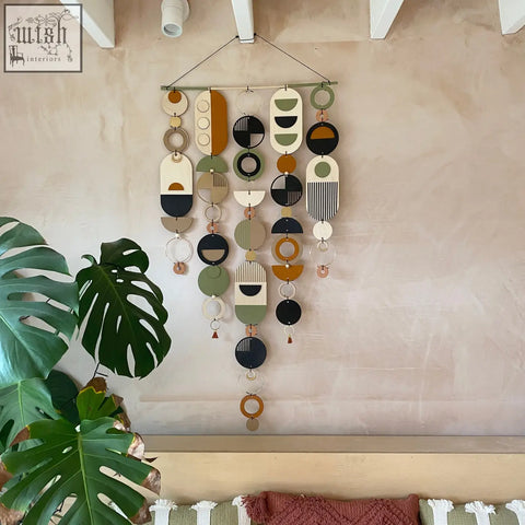 Modern art wooden wall hanging with hand painted geometric shapes in earthy tones winning design awards wall art