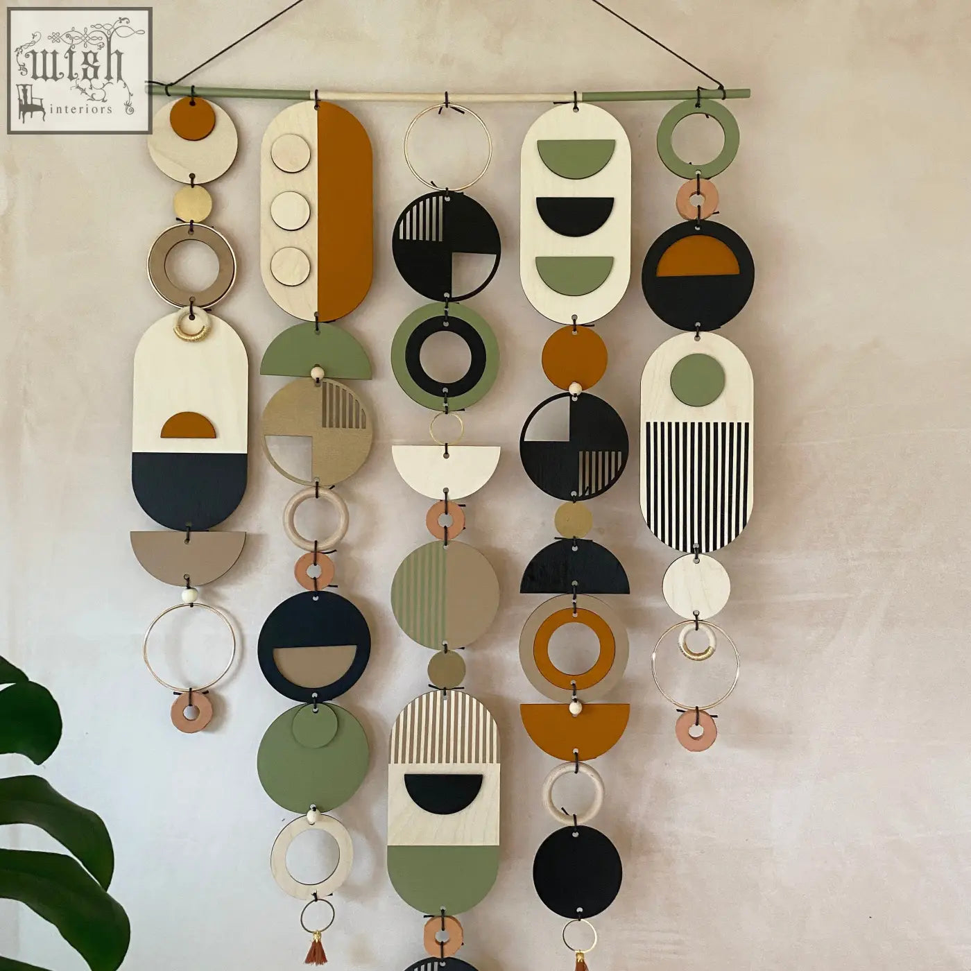 Modern art wooden wall hanging with hand painted geometric shapes in earthy tones winning design awards wall art
