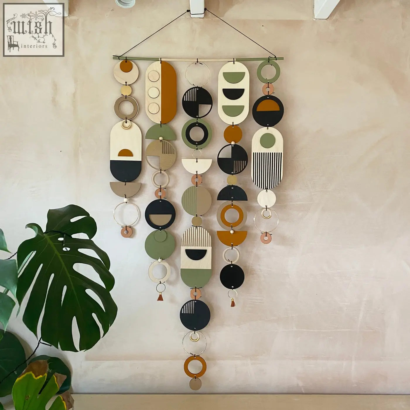 Modern art wooden wall hanging with hand painted layered shapes in earthy tones and design awards wall art