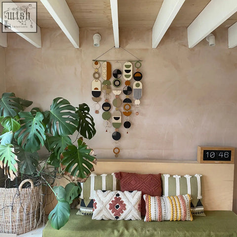Modern art wooden wall hanging with hand painted geometric discs in earthy tones winner of design awards 2022 wall art