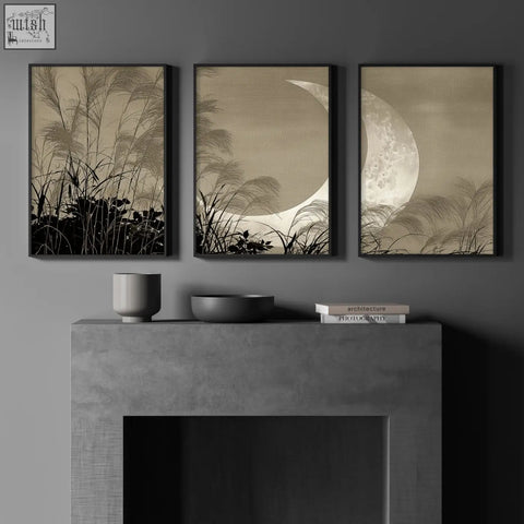 Three sepia toned crescent moon modern asian wall art prints with reeds hang above a concrete fireplace mantel