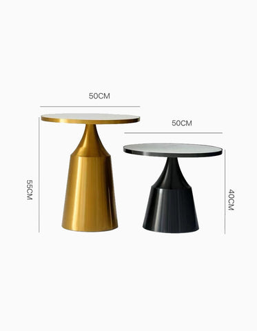 Modern coffee table set with sleek gold and black tapered metal bases and white marble round tops