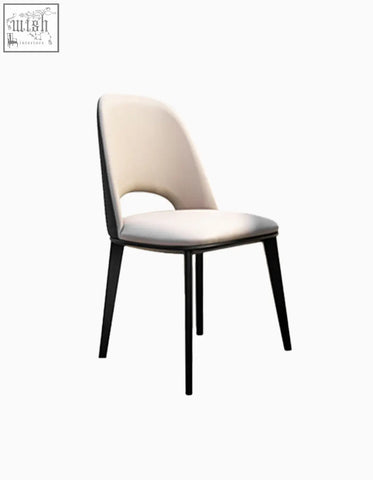 Modern contexture dining chair with cream upholstered seat and back and sleek black metal legs for dining room use