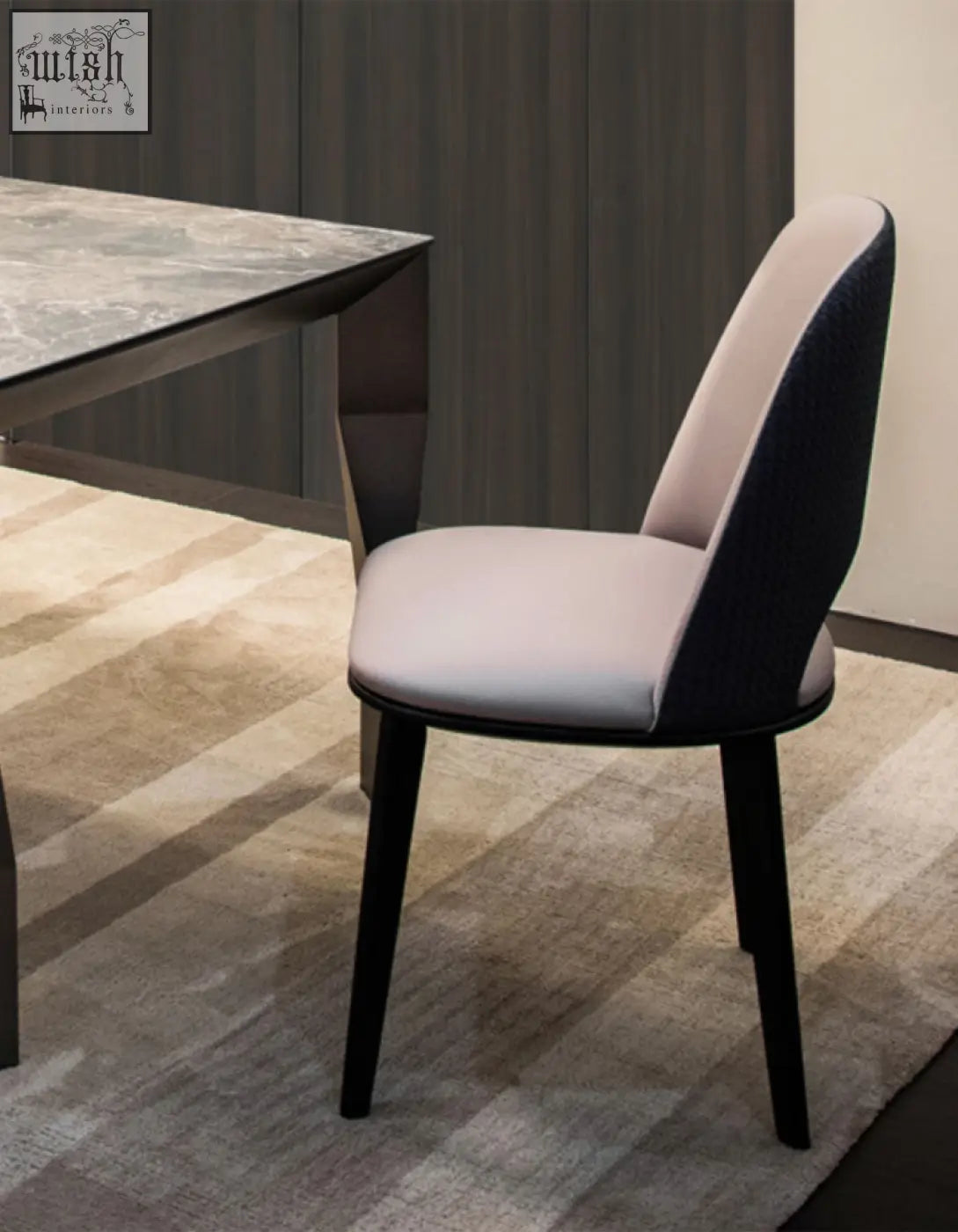 Modern contexture dining chair with sleek two-tone beige and black fabric seat and slender black metal legs