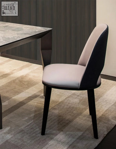 Modern contexture dining chair with sleek two-tone beige and black fabric seat and slender black metal legs