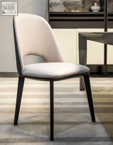 Modern contexture dining chair with cream upholstered seat and backrest and black metal legs in minimalist style