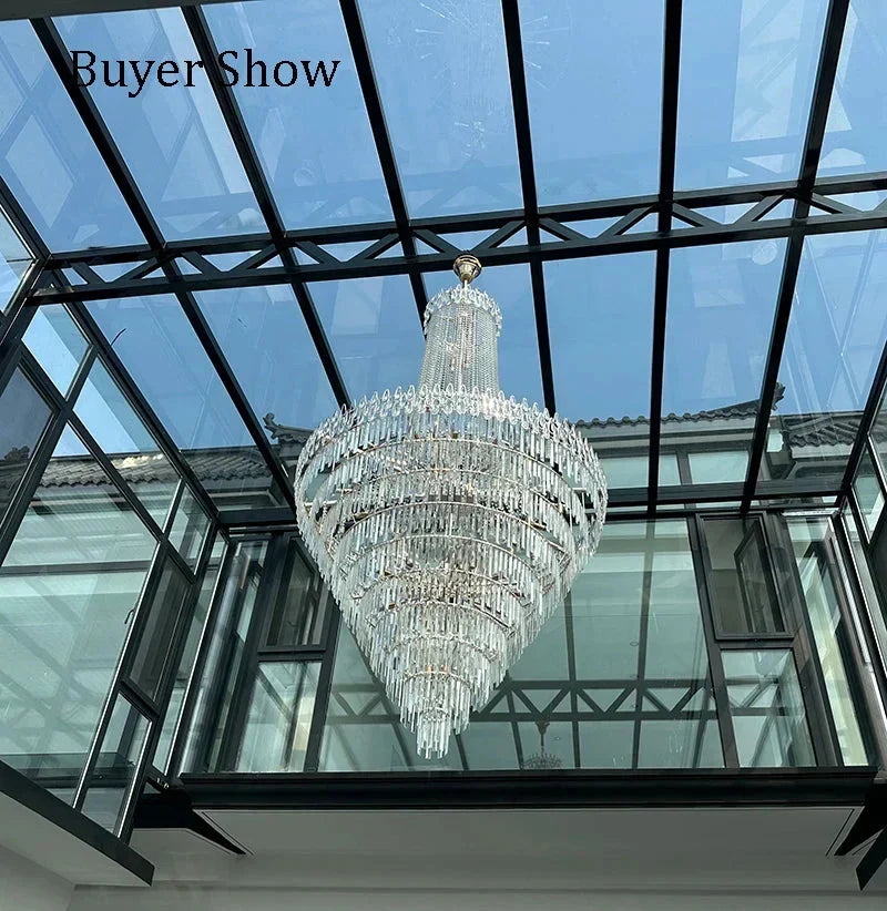 Modern crystal chandelier with gold-toned fixture and clear glass prisms perfect for wedding hall hotel hall or villa living room