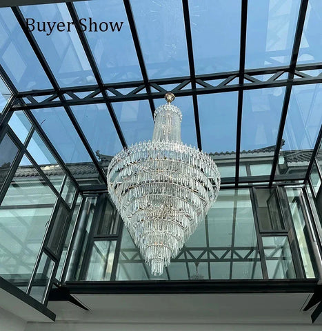 Modern crystal chandelier with gold-toned fixture and clear glass prisms perfect for wedding hall hotel hall or villa living room