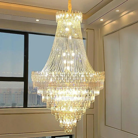 A modern crystal chandelier with clear faceted crystals and warm golden light perfect for hotel hall or wedding villa
