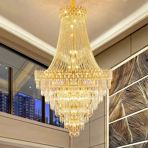 Modern crystal chandelier with golden tiers of glass prisms and a decorative crown perfect for hotel hall and villa use