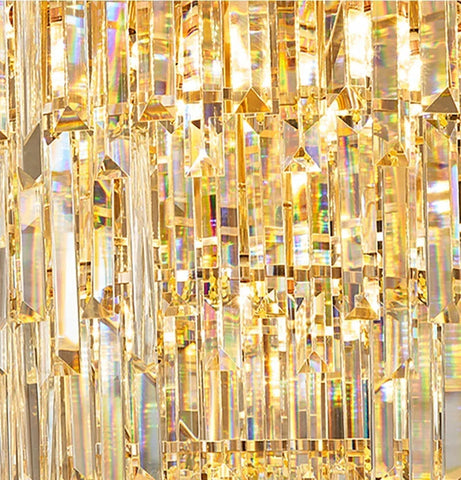 A modern crystal chandelier with golden faceted prisms casting rainbow light for hotel hall or wedding villa