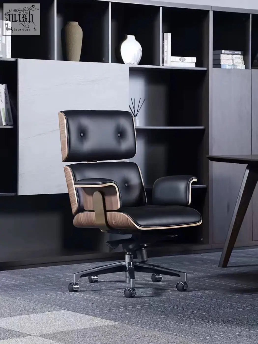 Black premium leather office chair with tufted upholstery and walnut wood accents for a modern office setup