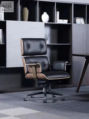 Black premium leather office chair with tufted upholstery and walnut wood accents for a modern office setup