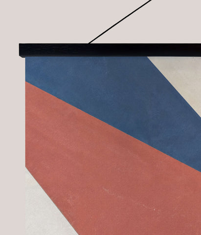 Modern geometric triangle tapestry with bold deep blue terracotta red and off-white geometric shapes on fabric wall art