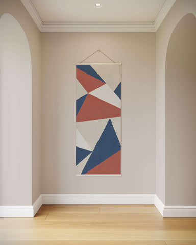 Modern geometric triangle tapestry with bold navy blue terracotta red and cream triangles on canvas background